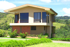 The modern 3-story home sits high above the lake.